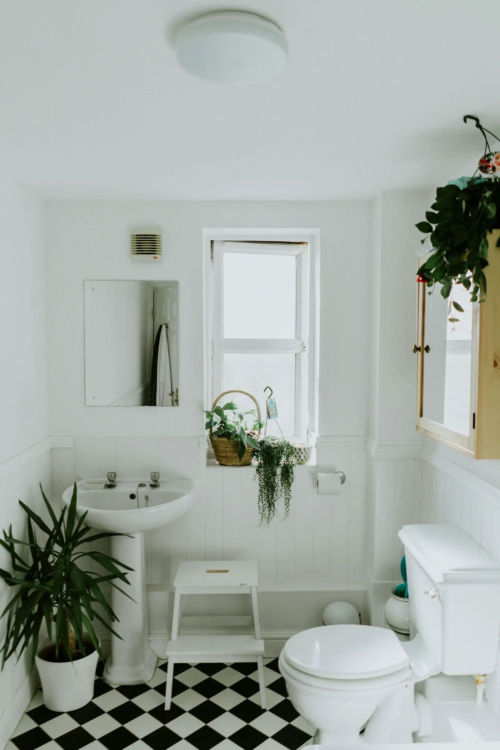 Stock photo of a bright bathroom vanity, illustrating hidden moisture behind finished walls