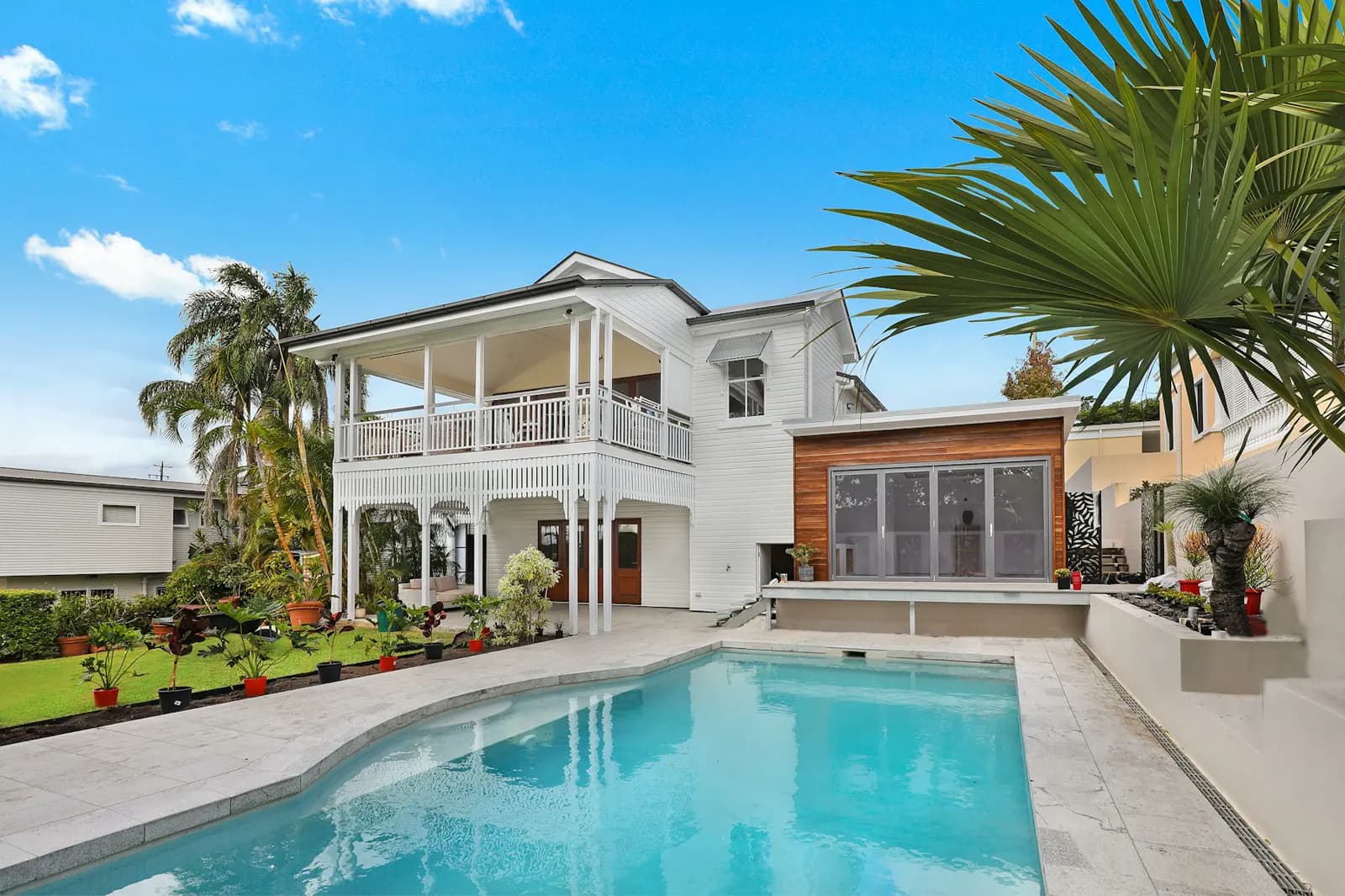 Stock photo of a house on a concrete pad, illustrating slab foundation plumbing risk