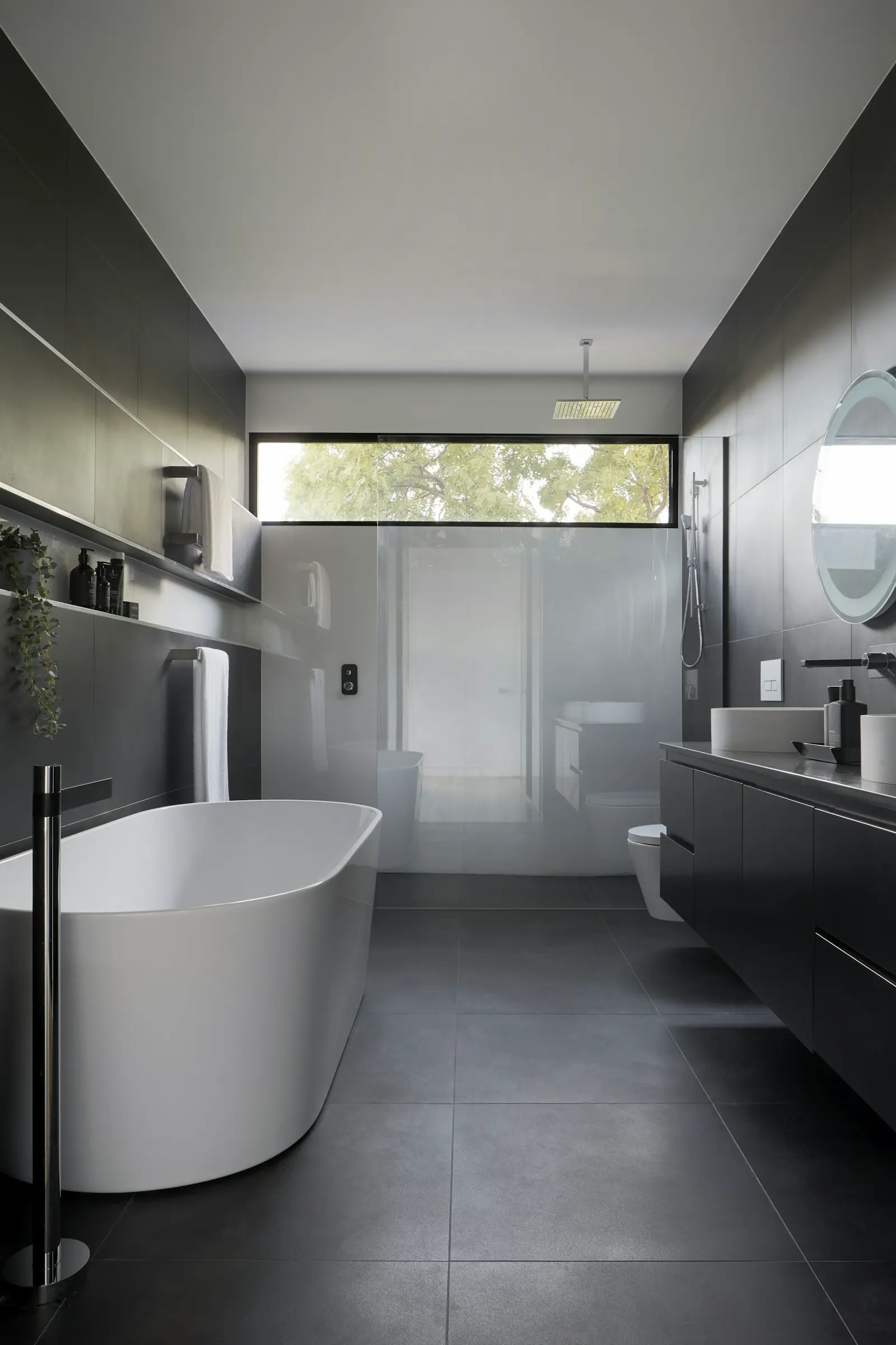 Stock photo of a tiled shower, illustrating bathroom fixture repair context